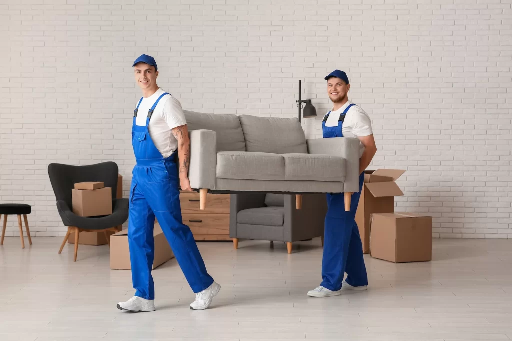 two men's moves a sofa and move in residential place