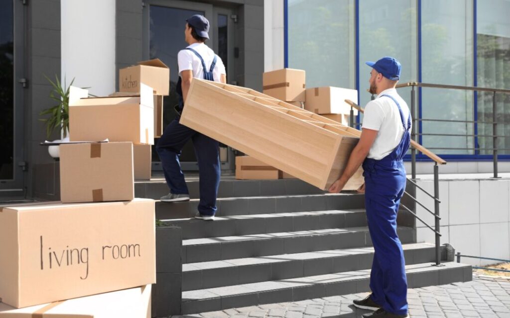 Two men's move a housing items in Bronx, NY