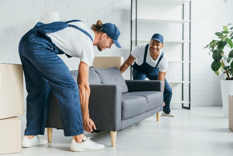 A professional movers moves a sofa